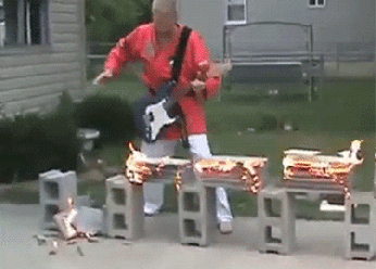 rock-guitar-breaking-flaming-bricks-karate.gif_zoom=2