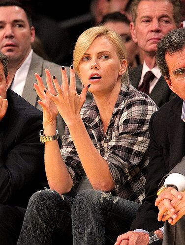 Charlize-Theron-Rolex-DEEP-SEA-Lakers-Game-Clapping