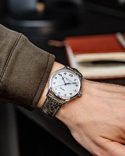 Silver wristshot green strap